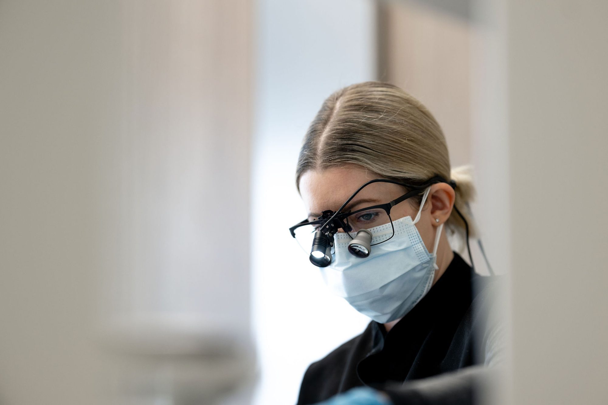 Hygienist focused on a routine dental cleaning